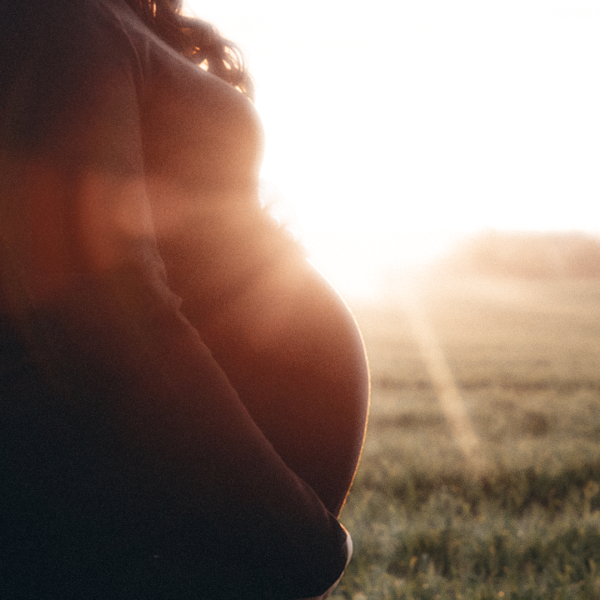 A color image showing the silhouette of a pregnant woman. Credit: Shutterstock